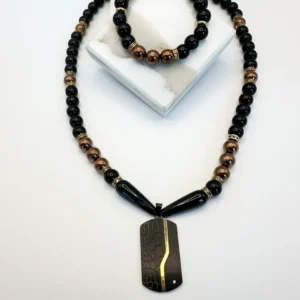 A beaded necklace with a rectangular pendant featuring a gold streak.