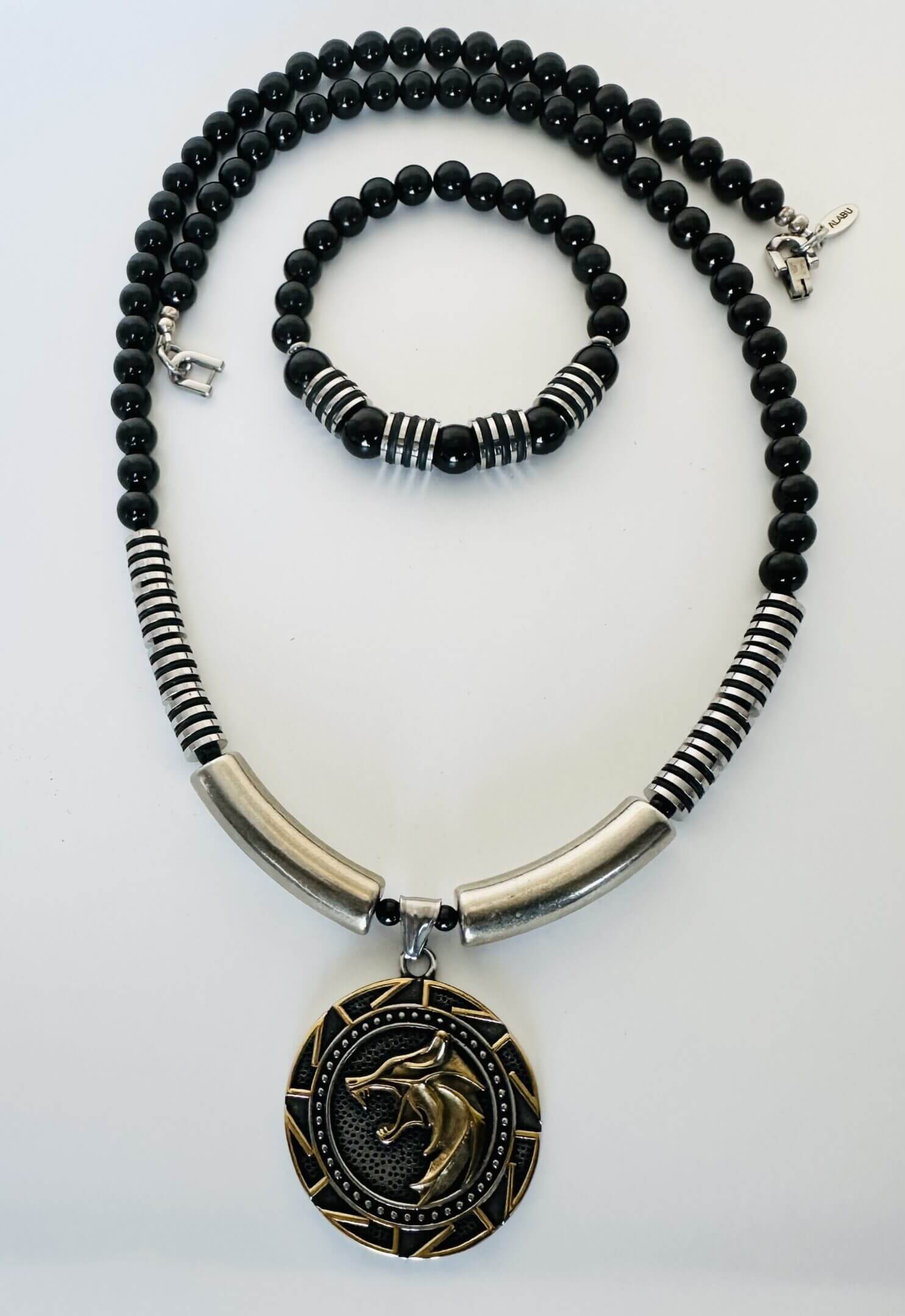 Black and silver beaded necklace with matching bracelet and dragon pendant.