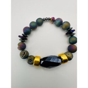 Beaded bracelet with a large black centerpiece and gold accents.