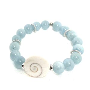 Blue bead bracelet with a white spiral shell centerpiece.