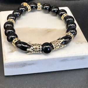 Black beaded bracelet with gold accents.